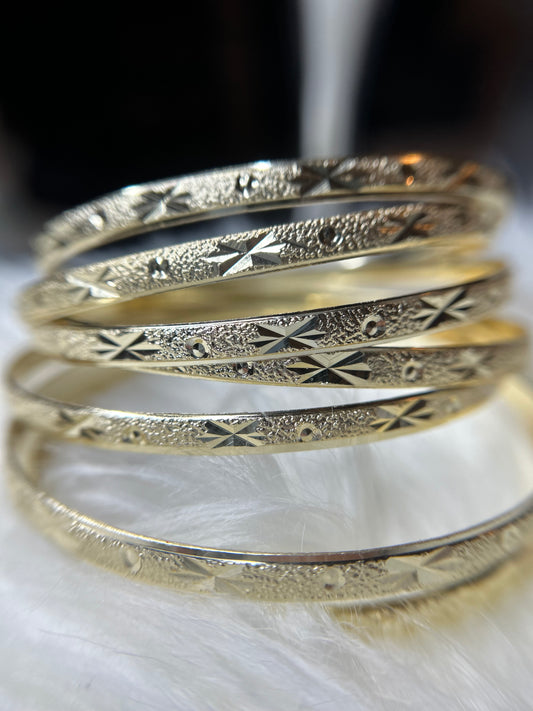 7 gold plated bangles- size 8