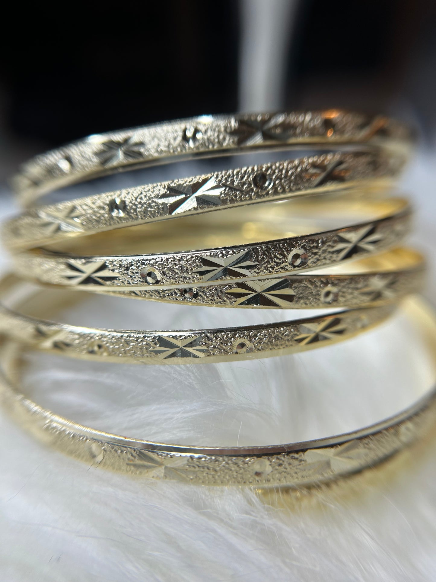 7 gold plated bangles- size 8