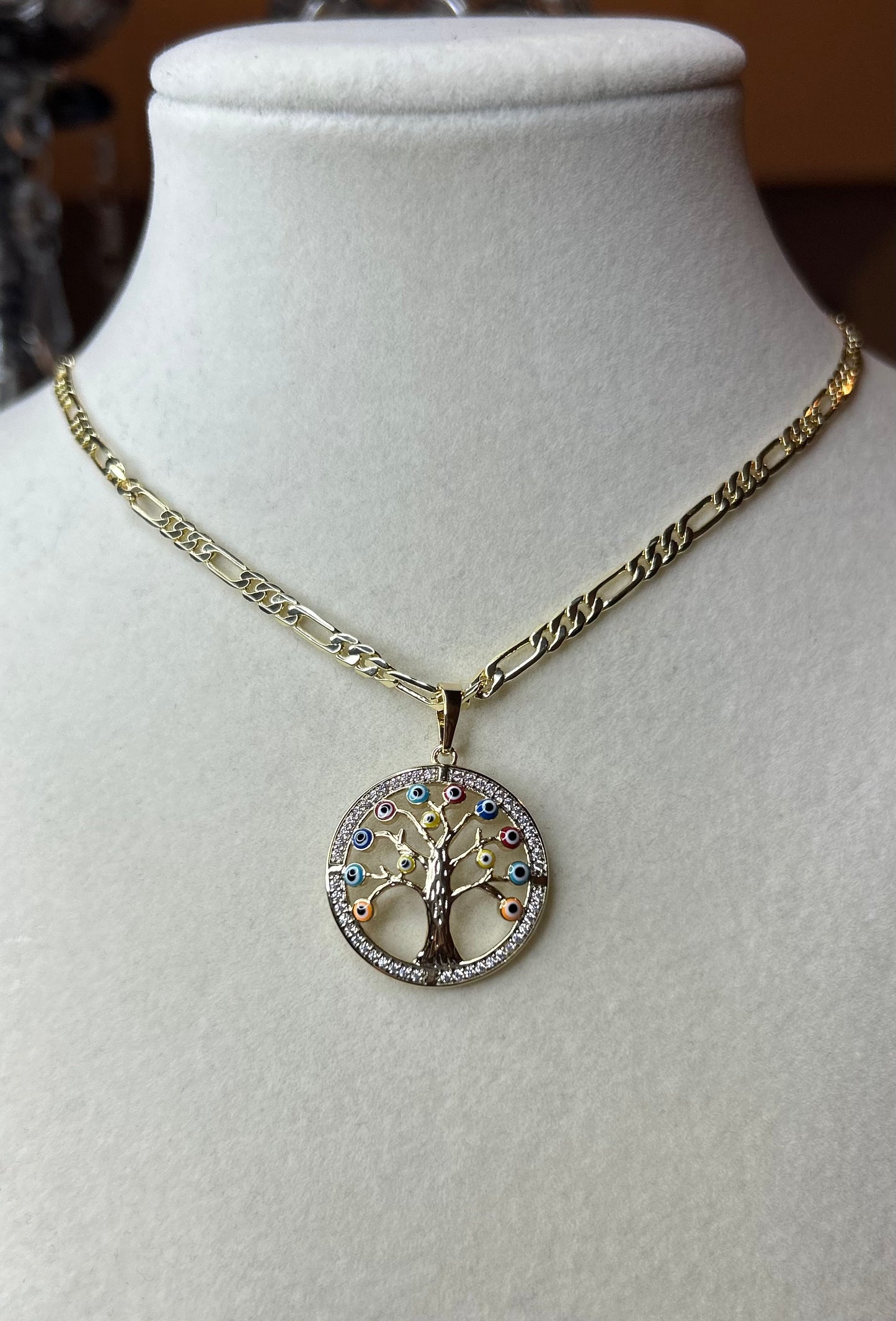 Tree of life with multicolored eyes necklace.