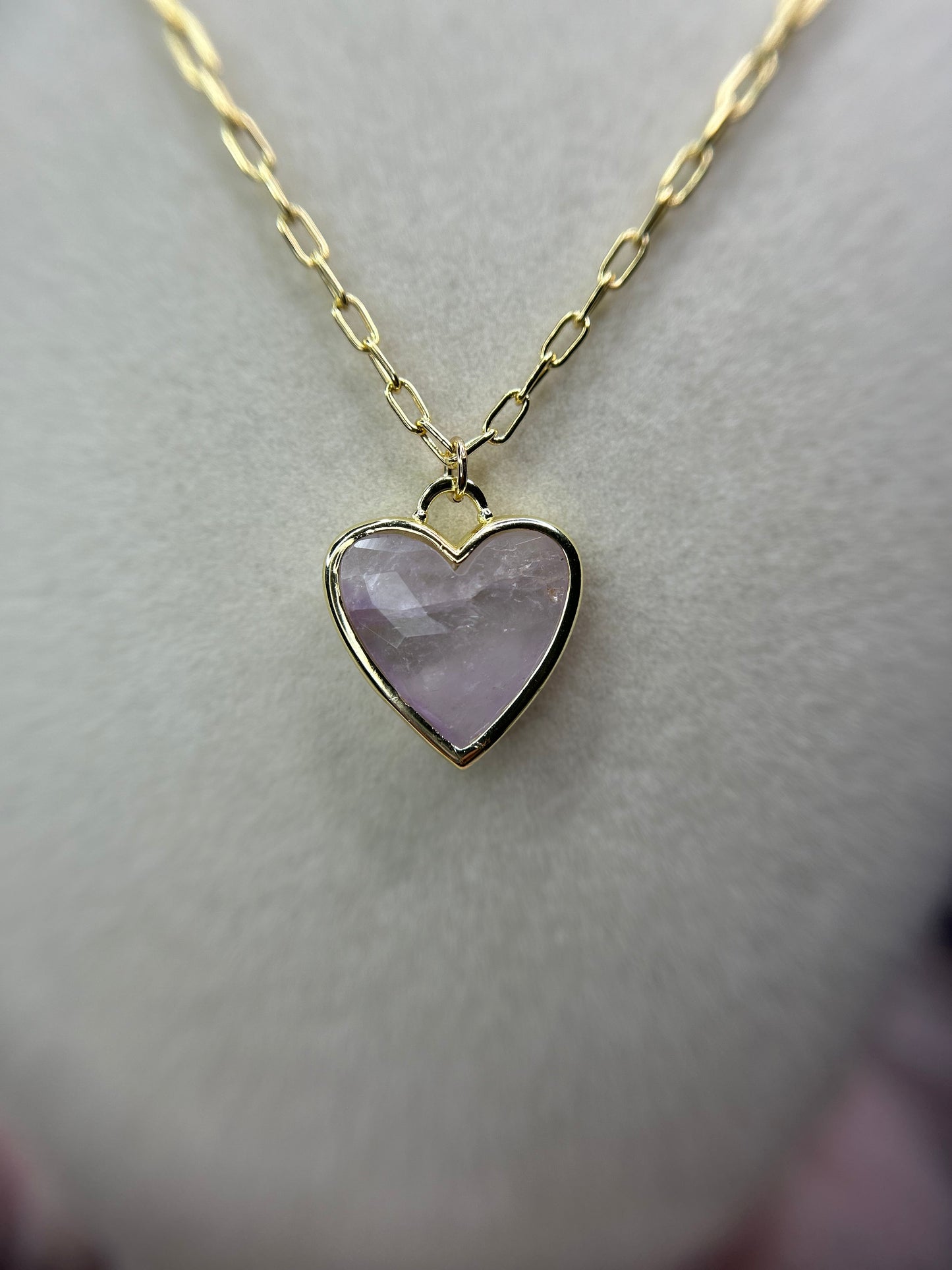 Light pink stone heart with zodiac sign.