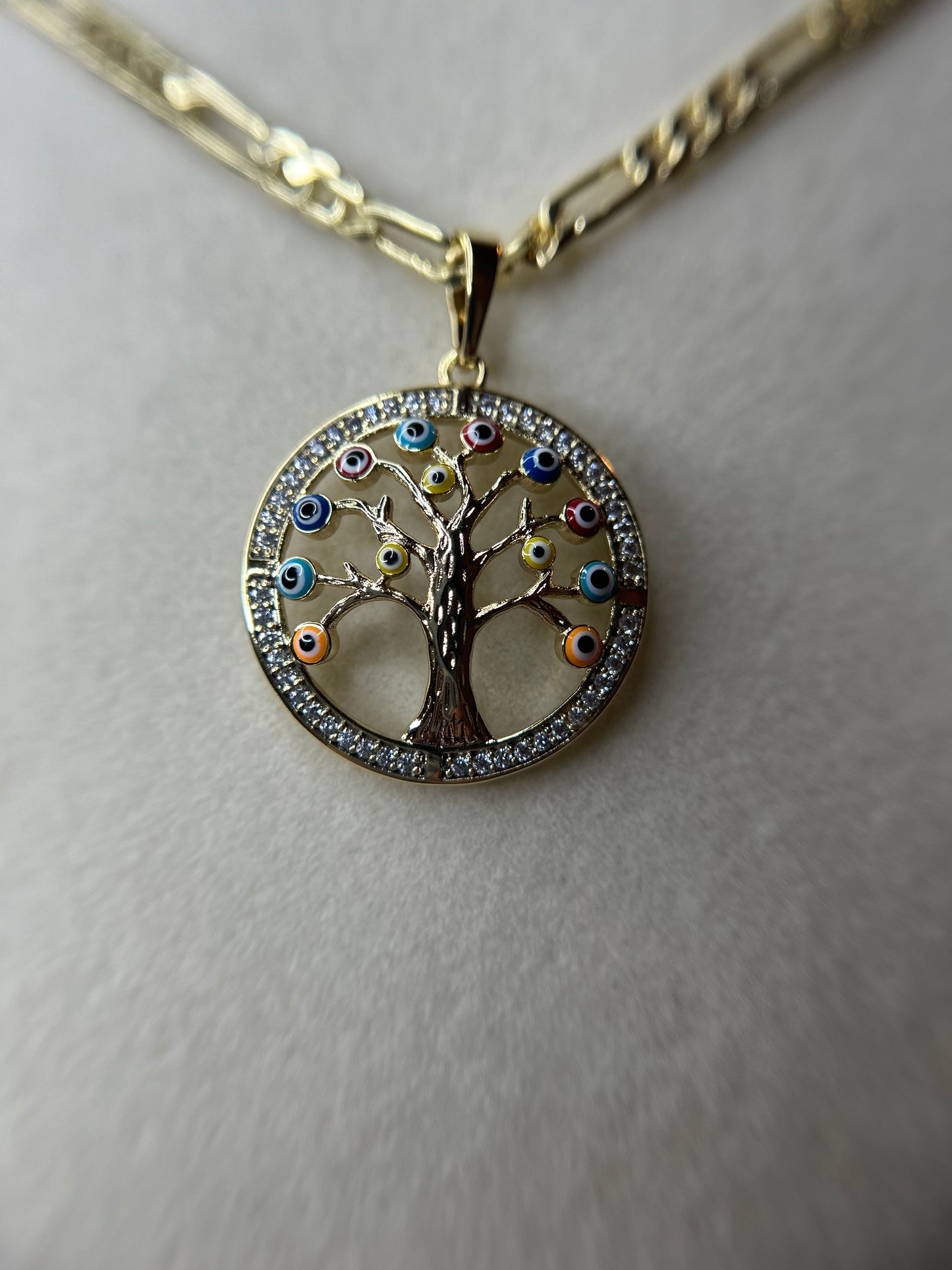 Tree of life with multicolored eyes necklace.