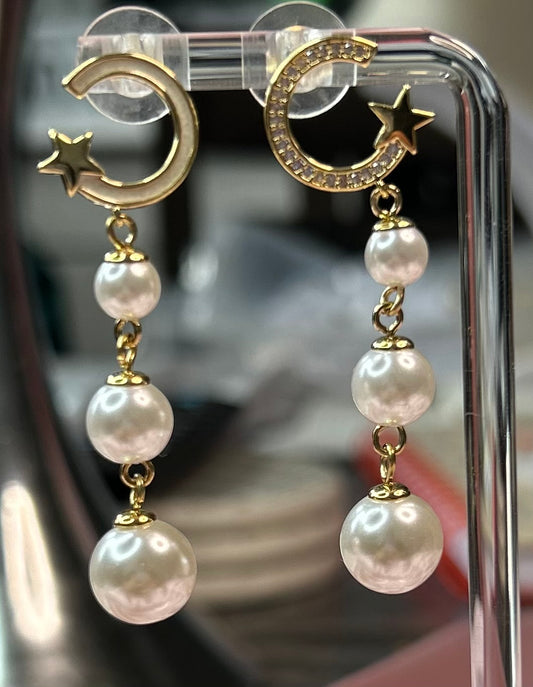 Dangling pearl earrings