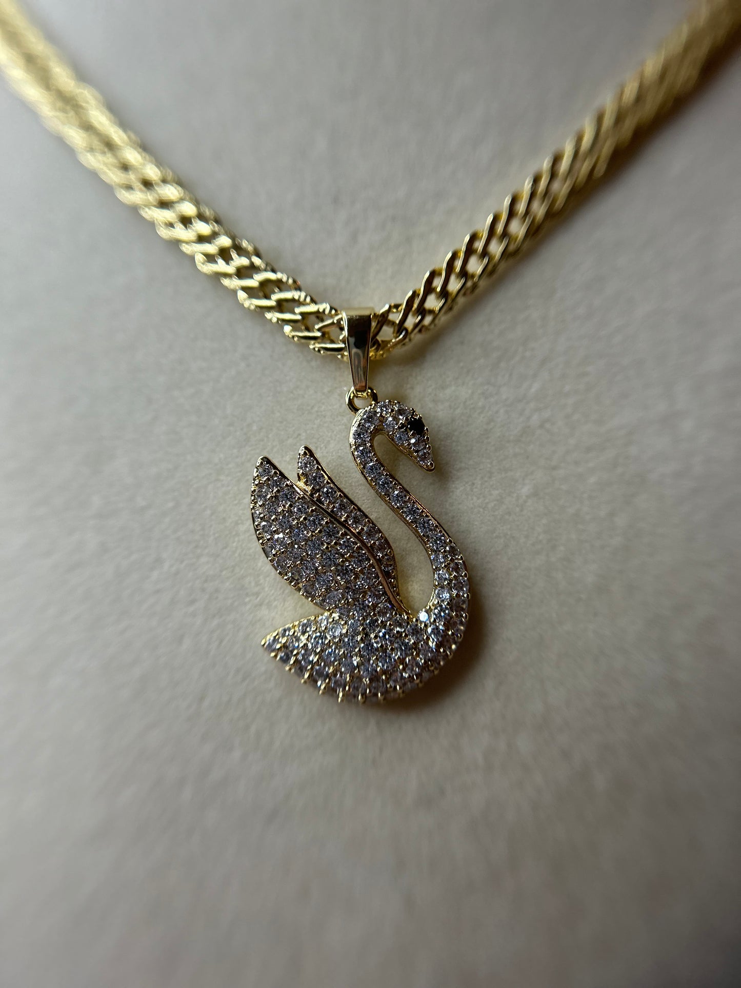 Swan with Chinese chain.