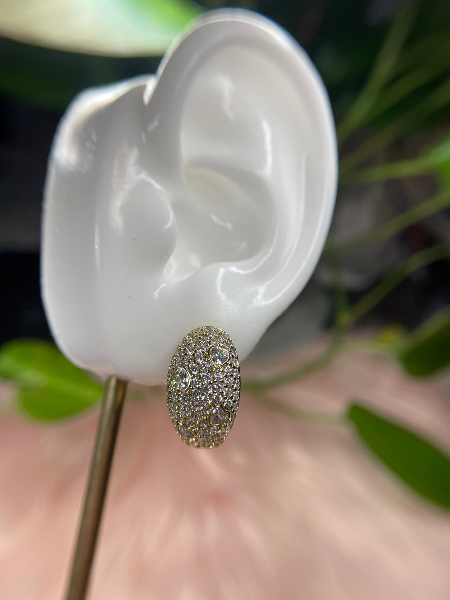 Earrings with white stones.