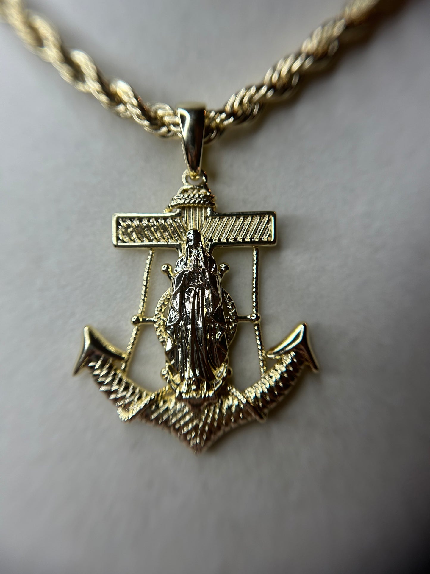 Rope chain with Anchor pendant with lady of Guadalupe.