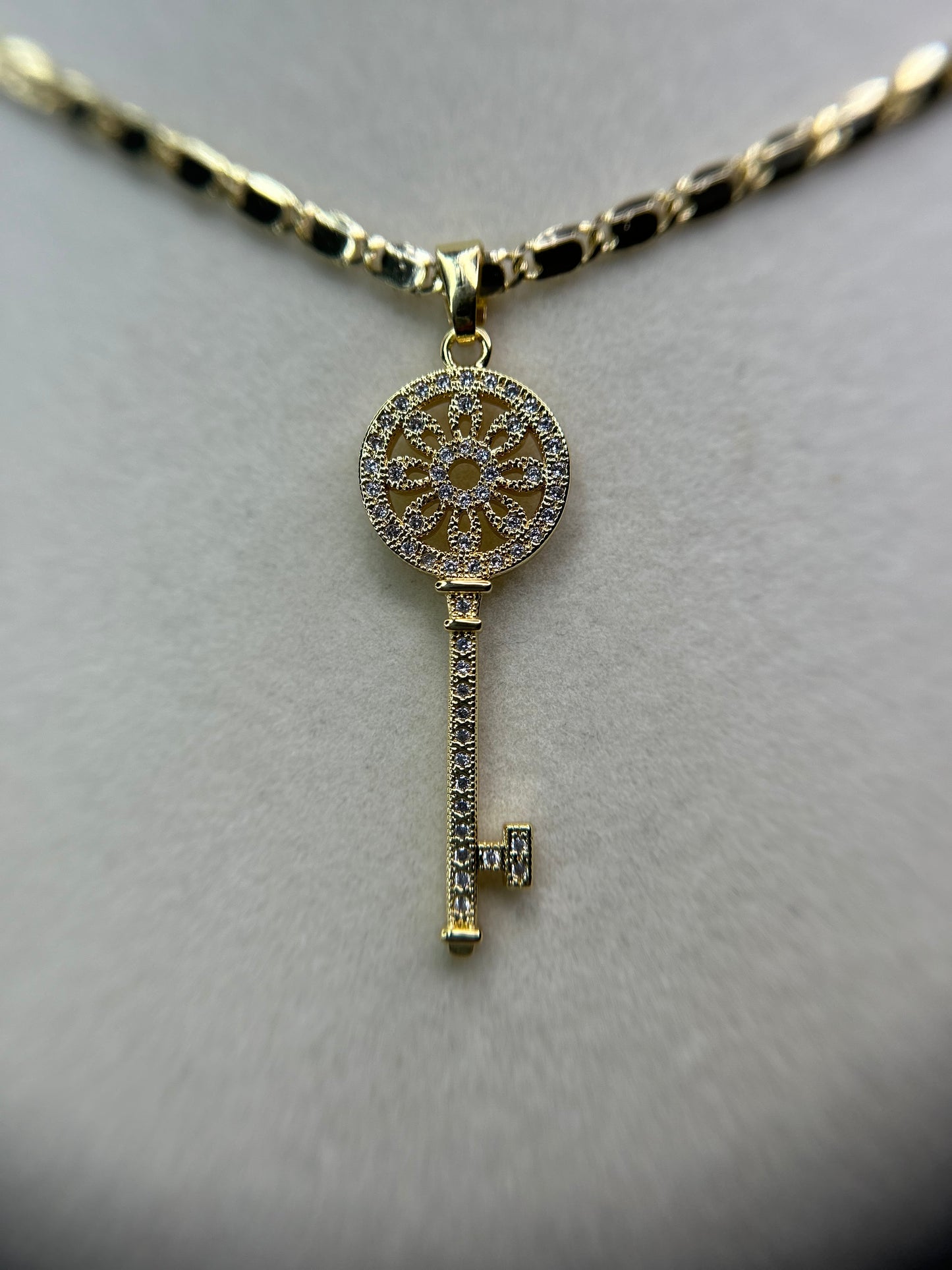 Key pendant with necklace.