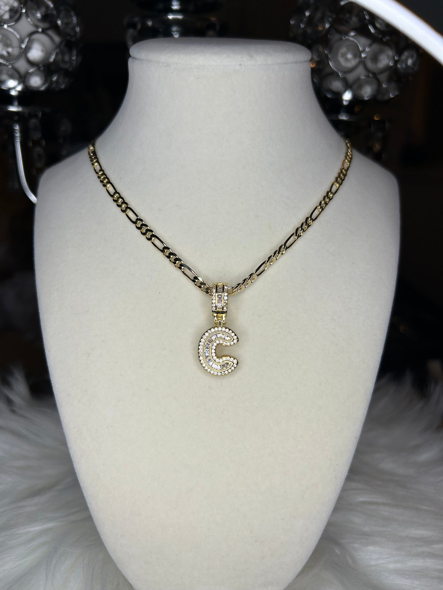 Initial C with Figaro necklace.